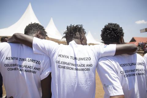 Residents watch the activities during the USAID/Kenya Tuna Uwezo-sponsored Community Achievements celebration held in the informal settlement of Dandora on March 17, 2016. The program works to reduce politically-motivated conflict and violent extremism in Nairobi’s informal settlements by strengthening social networks of community members and civil society groups to collaborate productively on community issues and address grievances. /Stephine Ogutu, Global Communities.